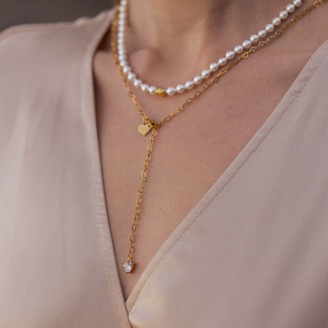 Zarte PURELEI Kette aus Roségold mit Muscheln und Herzanhänger, elegant und feminin.