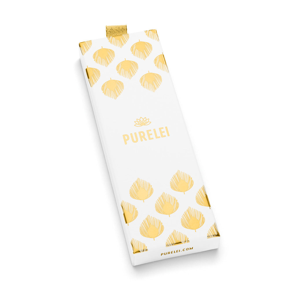 Mahina Club Kahakai Verpackung in Weiß mit goldenen Muschelmotiven, elegant und pur, PURELEI Brand.